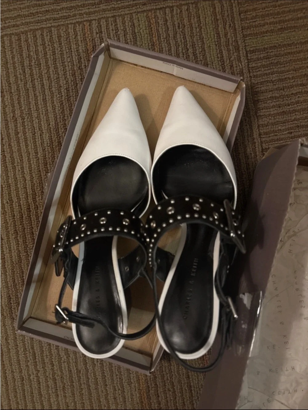 Charles & Keith White Pointed Slingback Heels with Black Studded Straps